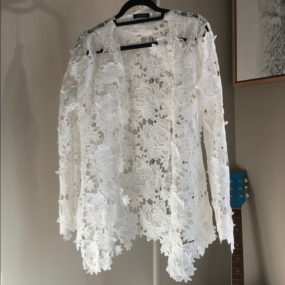 Banjul two piece white floral suit.